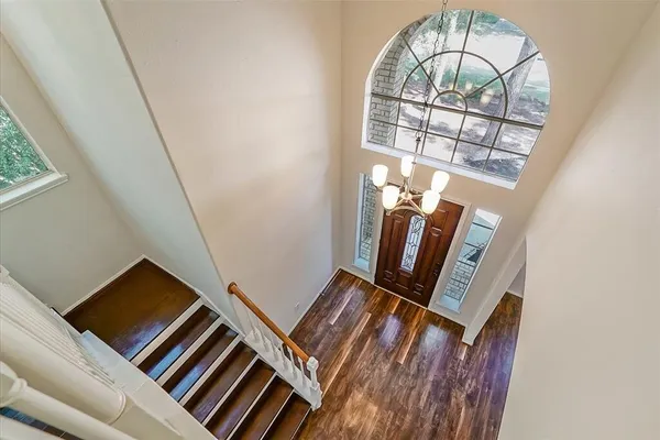 a view of an entryway with wooden floor