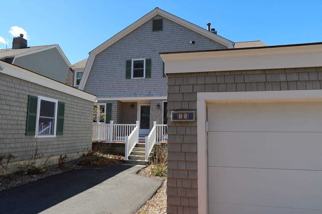 74 Branch Street, Unit 15 Scituate, MA 02066 - Photo 3 of 26 a front view of a house with garage