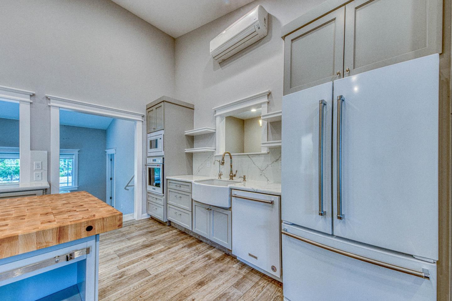 47317 Arroyo Seco Road Greenfield, CA 93927 - Photo 5 of 47 a kitchen with kitchen island a sink appliances and cabinets