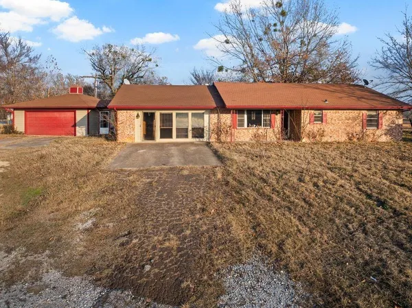 a front view of a house with yard