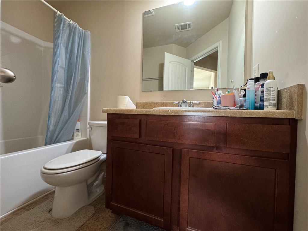 805 Pleasant Hill Road, Unit 333 Lilburn, GA 30047 - Photo 13 of 22 a bathroom with a sink and a toilet