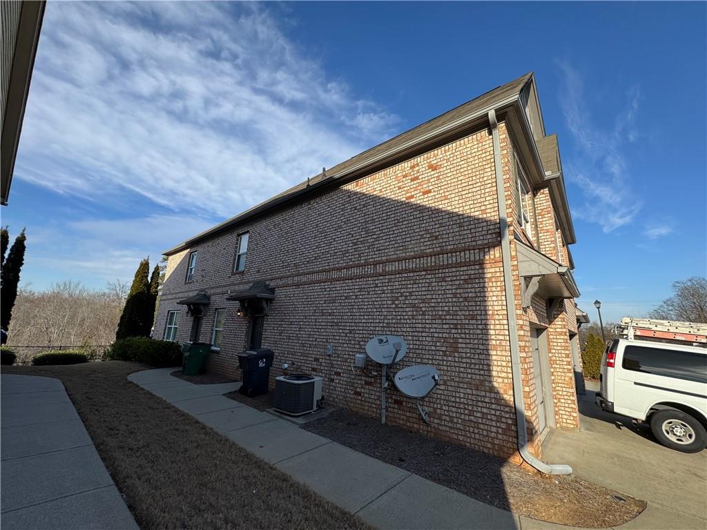 805 Pleasant Hill Road, Unit 333 Lilburn, GA 30047 - Photo 16 of 22 a view of house and car parked in front of house
