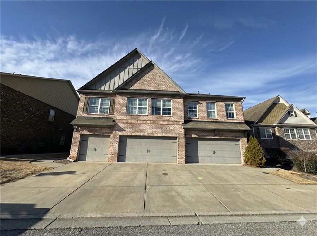 805 Pleasant Hill Road, Unit 333 Lilburn, GA 30047 - Photo 22 of 22 a front view of a house with a yard