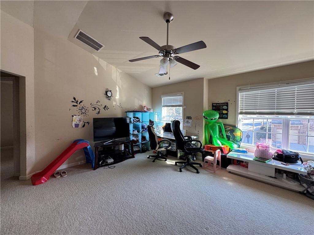 805 Pleasant Hill Road, Unit 333 Lilburn, GA 30047 - Photo 4 of 22 a children room with furniture and a window