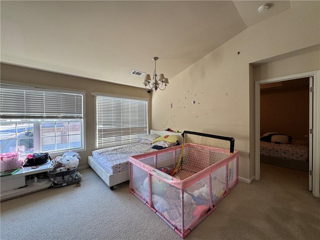 805 Pleasant Hill Road, Unit 333 Lilburn, GA 30047 - Photo 7 of 22 a bedroom with furniture and a window