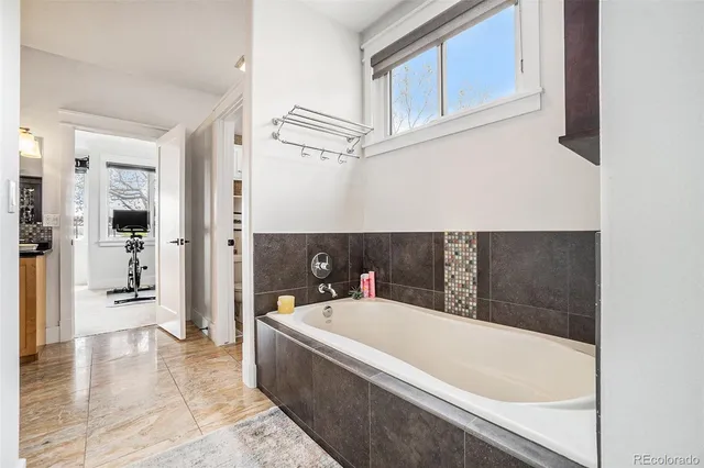 a bathroom with a bathtub and a shower