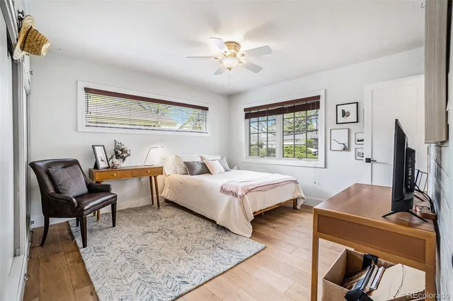 a spacious bedroom with a bed and a couch