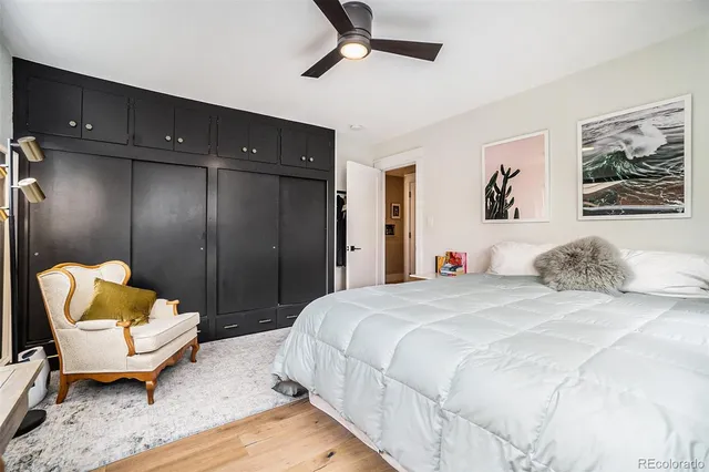 a spacious bedroom with a bed and a couch