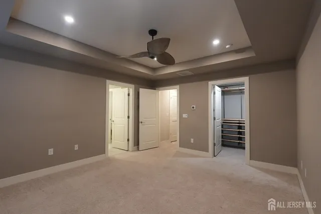 a view of empty room with ceiling fan