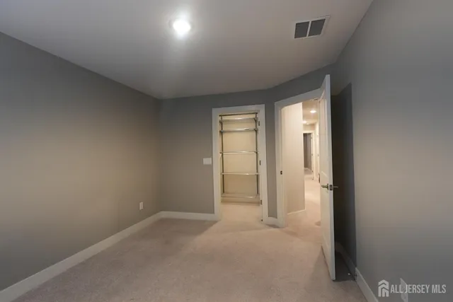 a view of an empty room and a window