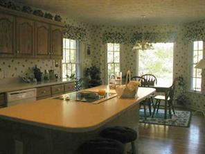 497 Kemp Road Mooresville, NC 28117 - Photo 4 of 8 a view of a dining room with furniture window and wooden floor