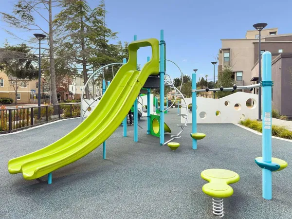 a view of a park with a slide