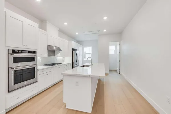 a large kitchen with cabinets