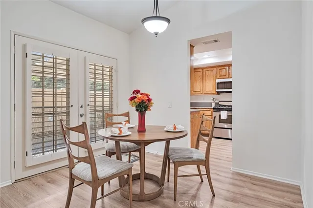 a view of a dining room with furniture window and wooden floor