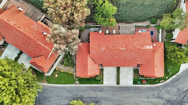 an aerial view of multiple houses with yard