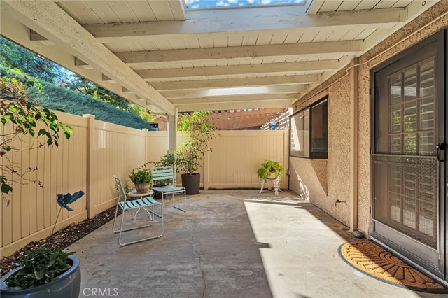 a view of a swimming pool with a garden and trees