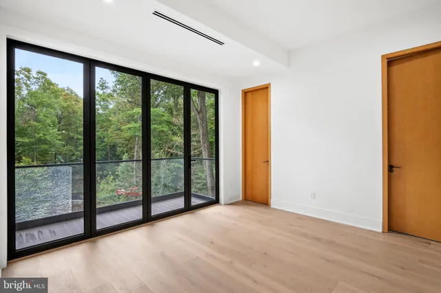 a view of an empty room with windows