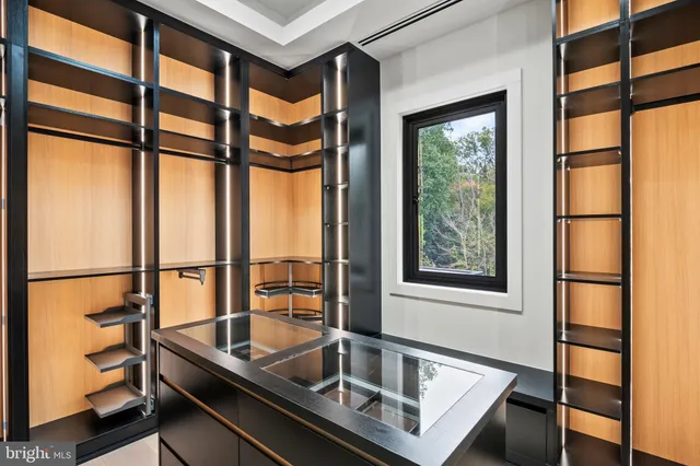 a view of a big room with wooden floor and doors