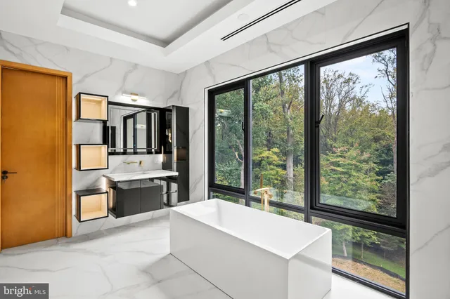 a view of a big room with wooden floor and windows