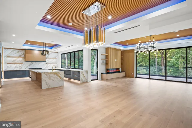 a room with a bed and large window