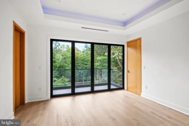a bathroom with a granite countertop sink mirror vanity and toilet