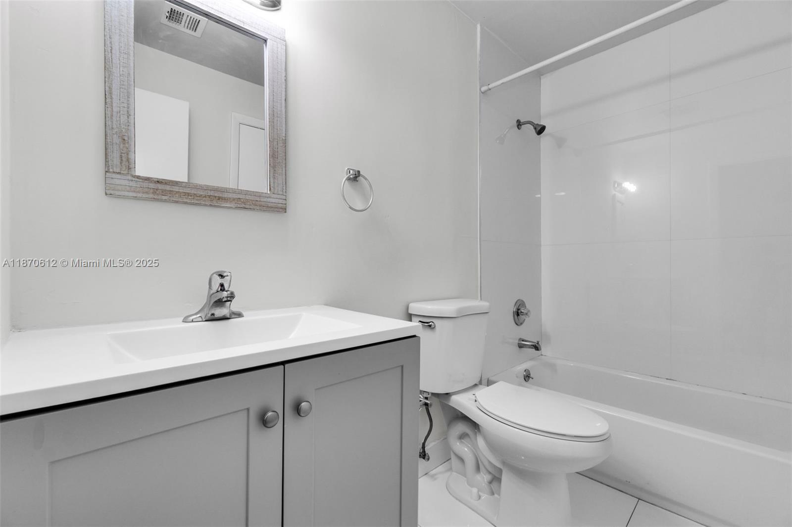 6514 Southwest 128th Place, Unit 6514 Miami, FL 33183 - Photo 23 of 46 a bathroom with a sink a toilet and shower