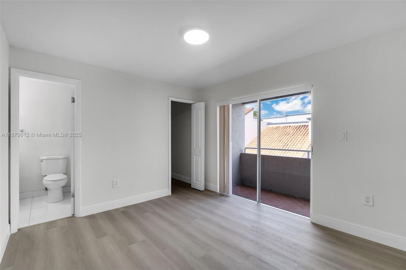 6514 Southwest 128th Place, Unit 6514 Miami, FL 33183 - Photo 24 of 46 a view of room with window and hardwood floor