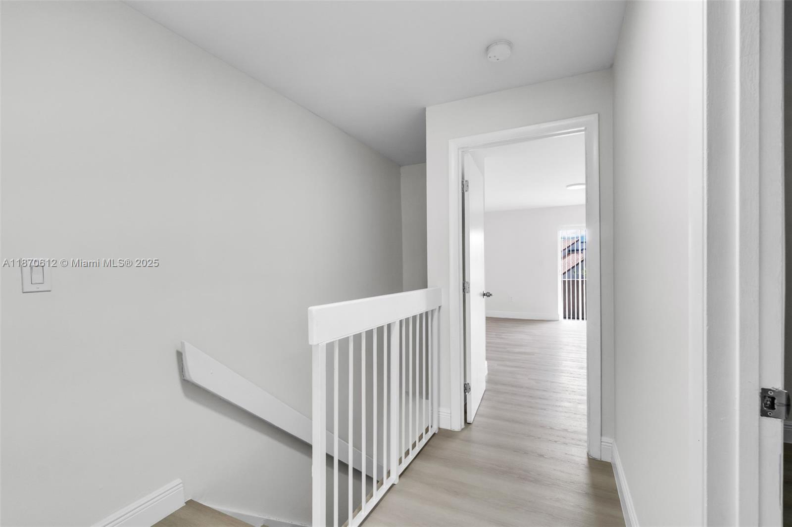 6514 Southwest 128th Place, Unit 6514 Miami, FL 33183 - Photo 26 of 46 a view of a hallway with wooden floor