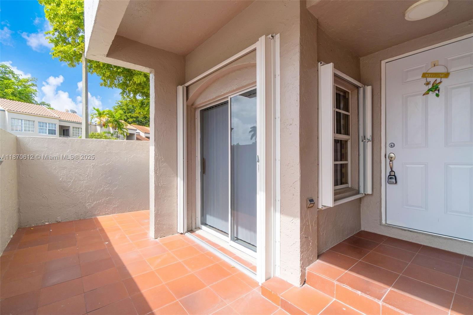 6514 Southwest 128th Place, Unit 6514 Miami, FL 33183 - Photo 3 of 46 a view of front door