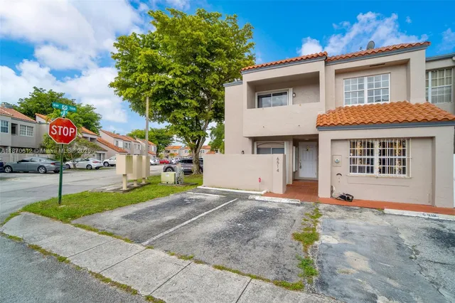 a front view of a house with a garage