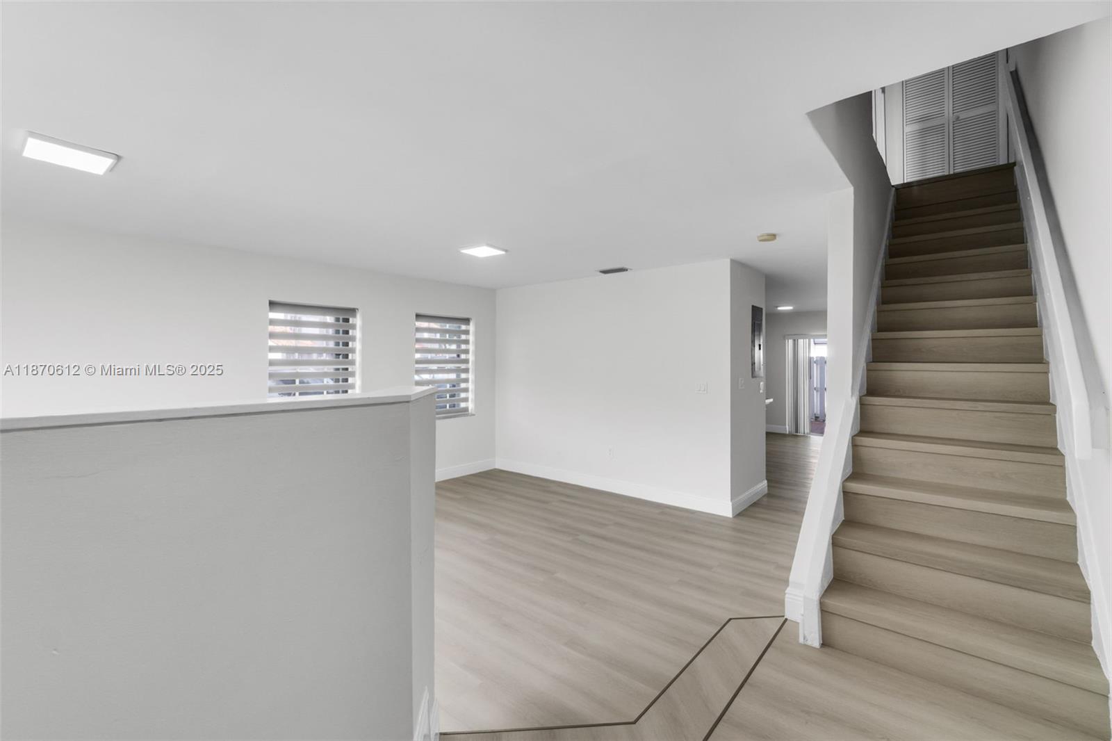 6514 Southwest 128th Place, Unit 6514 Miami, FL 33183 - Photo 5 of 46 a view of entryway and hall with wooden floor