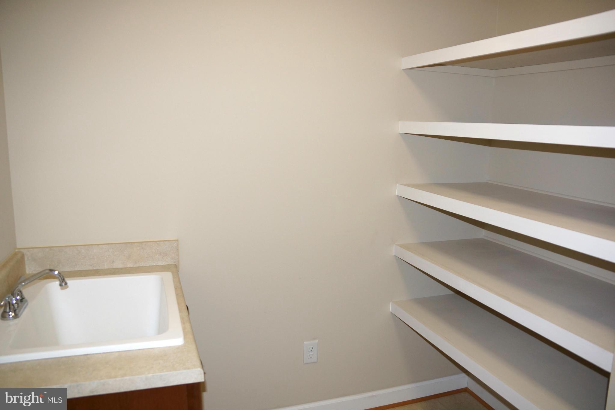 941 Winding Road Edgewater, MD 21037 - Photo 22 of 27 2nd flr Laundry Rm with built-in shelving