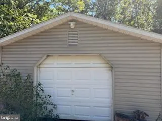 a view of a wooden door of the house