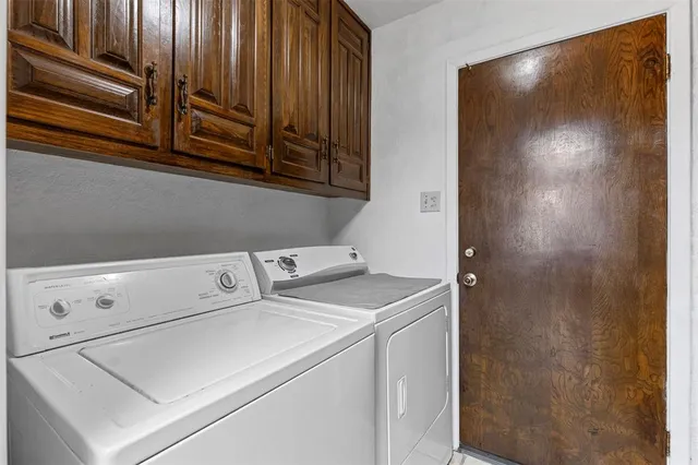 a bathroom with a granite countertop sink a mirror and shower