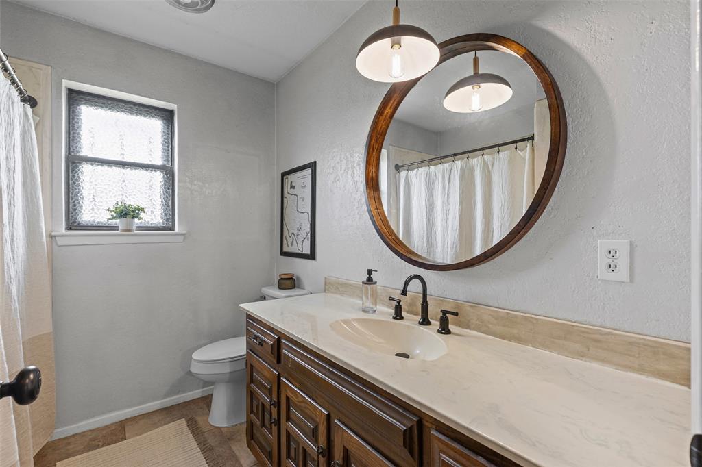 2900 Peel Road Springtown, TX 76082 - Photo 16 of 34 a bathroom with a sink and a mirror