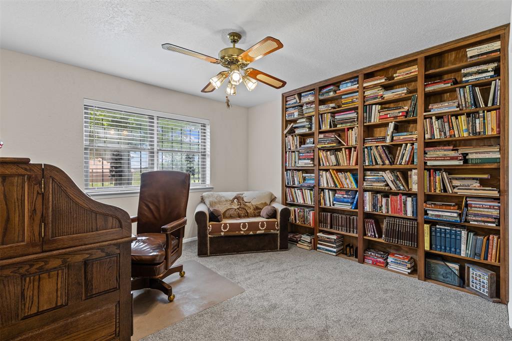 2900 Peel Road Springtown, TX 76082 - Photo 17 of 34 a view of a livingroom with workspace and a window