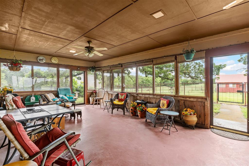 2900 Peel Road Springtown, TX 76082 - Photo 18 of 34 a living room with furniture and a floor to ceiling window