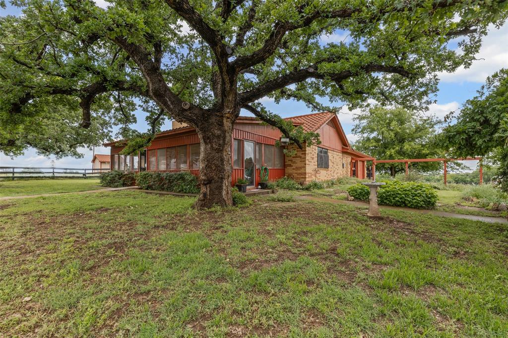 2900 Peel Road Springtown, TX 76082 - Photo 34 of 34 a view of a house with a yard