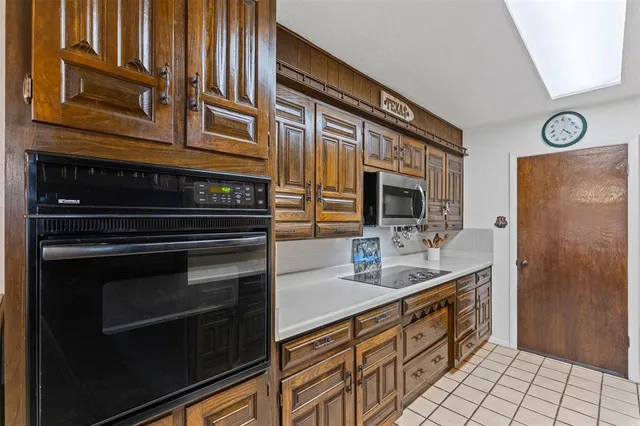 a bathroom with a sink a mirror and a shower