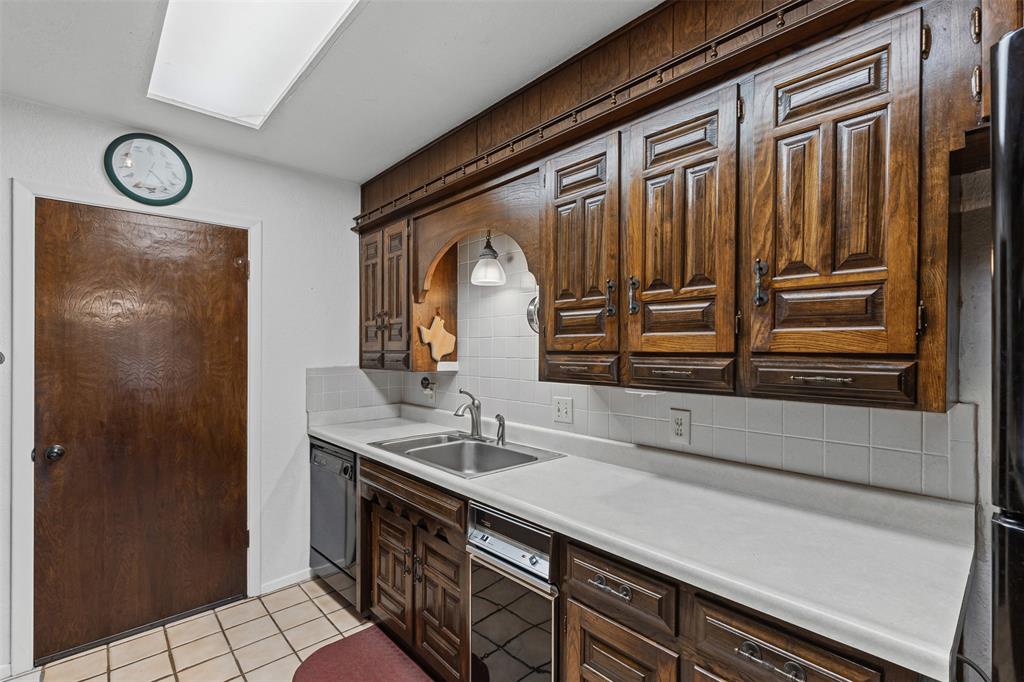 2900 Peel Road Springtown, TX 76082 - Photo 8 of 34 a bathroom with a sink a mirror and a shower