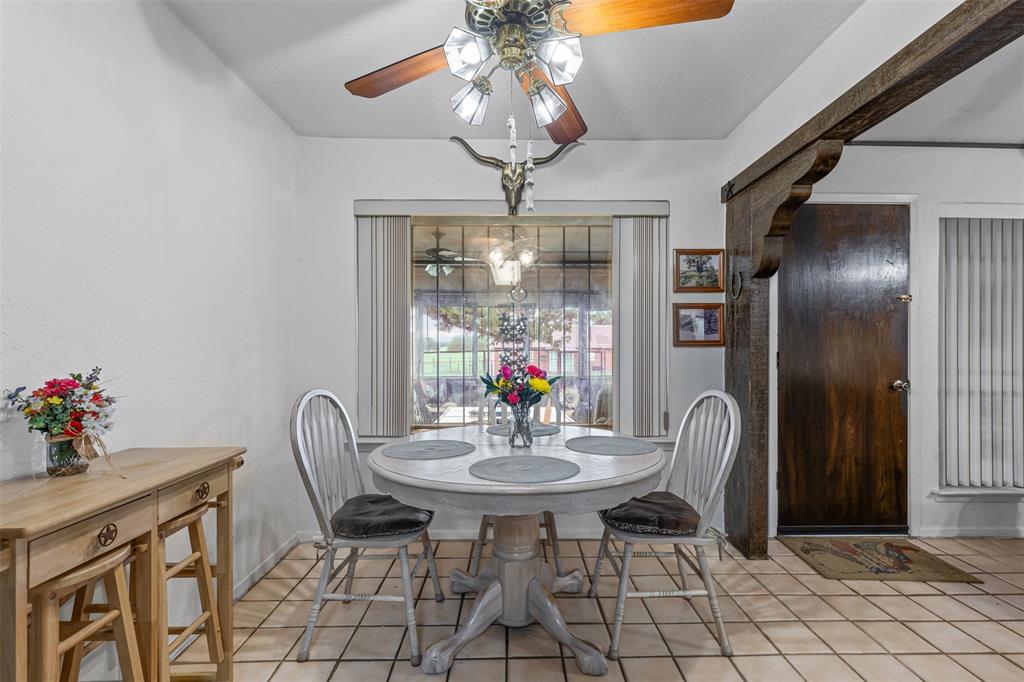 2900 Peel Road Springtown, TX 76082 - Photo 9 of 34 a view of a dining room with furniture and chandelier