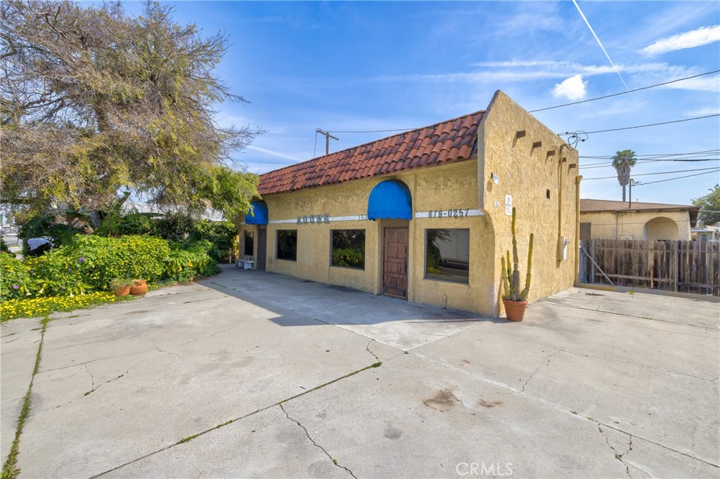 15216 Inglewood Avenue Lawndale, CA 90260 - Photo 15 of 23 a view of a house with a yard and garage