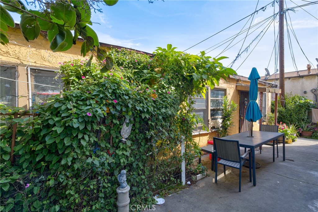 15216 Inglewood Avenue Lawndale, CA 90260 - Photo 18 of 23 a view of a house with backyard and sitting area