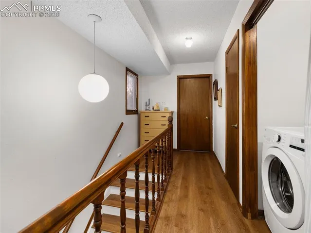 a view of a hallway with washer and dryer