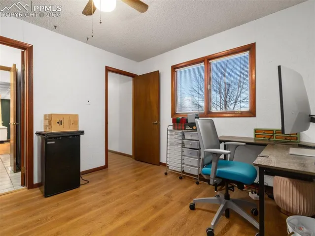 a workspace with furniture and wooden floor