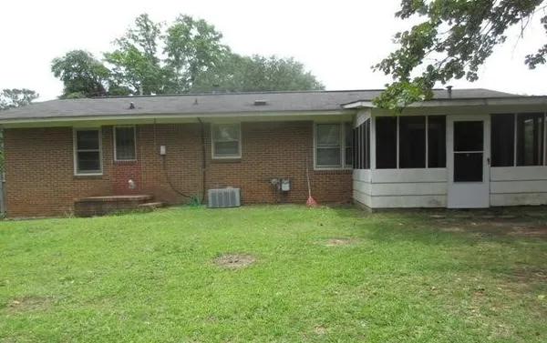 a view of a house with a garden