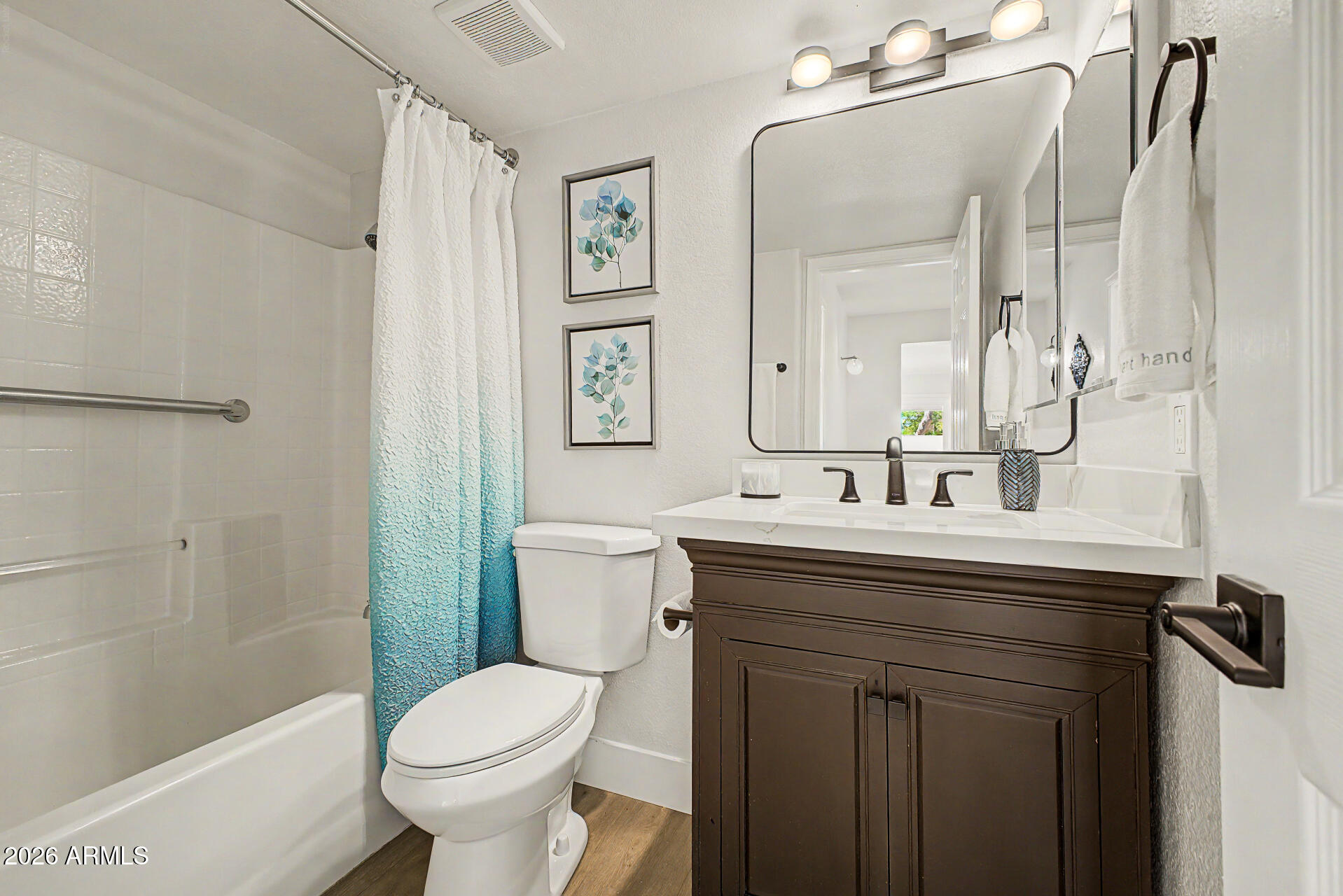 1743 East Redfield Road Gilbert, AZ 85234 - Photo 17 of 30 a bathroom with a sink toilet and shower