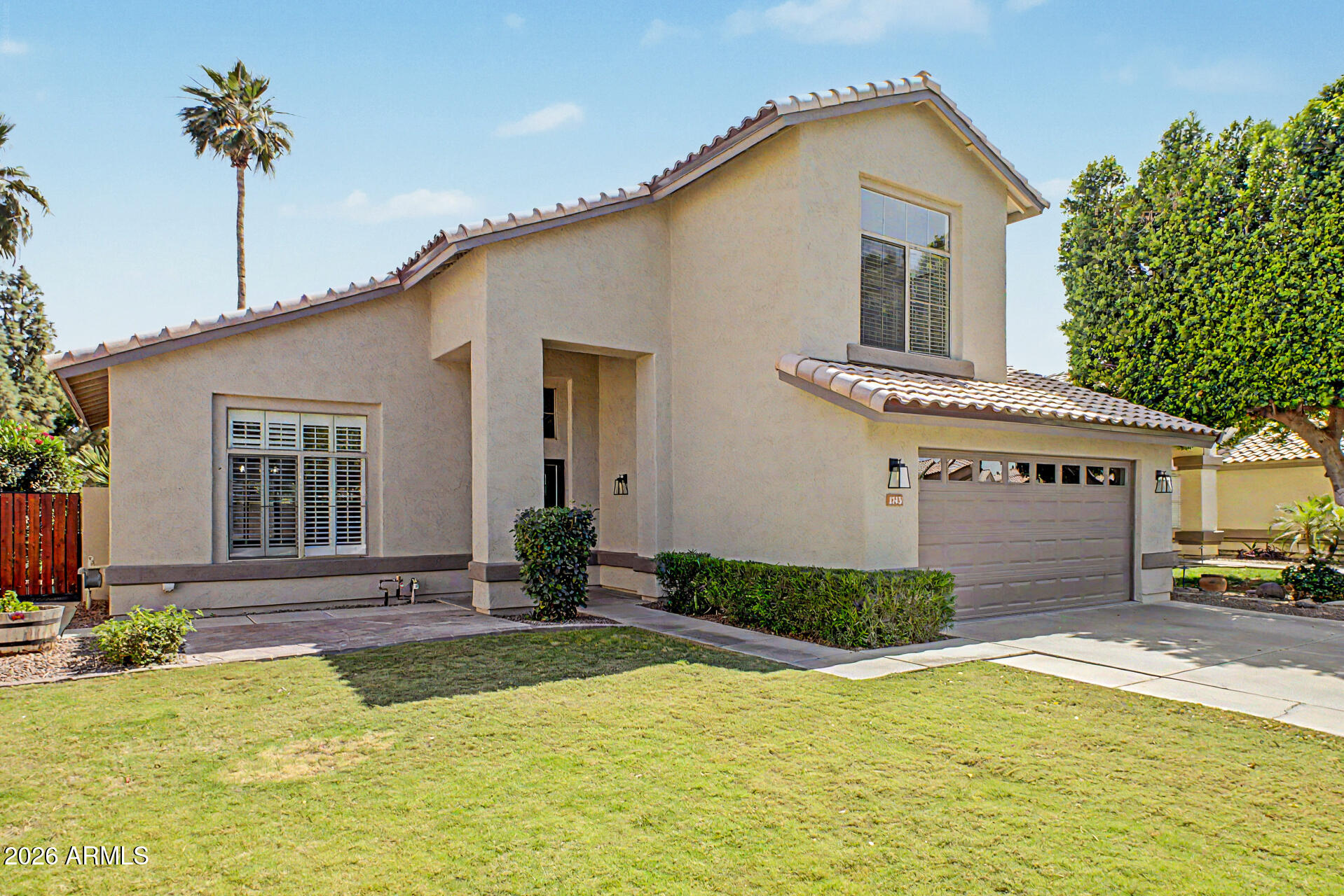 1743 East Redfield Road Gilbert, AZ 85234 - Photo 2 of 30 a front view of a house with yard and glass windows