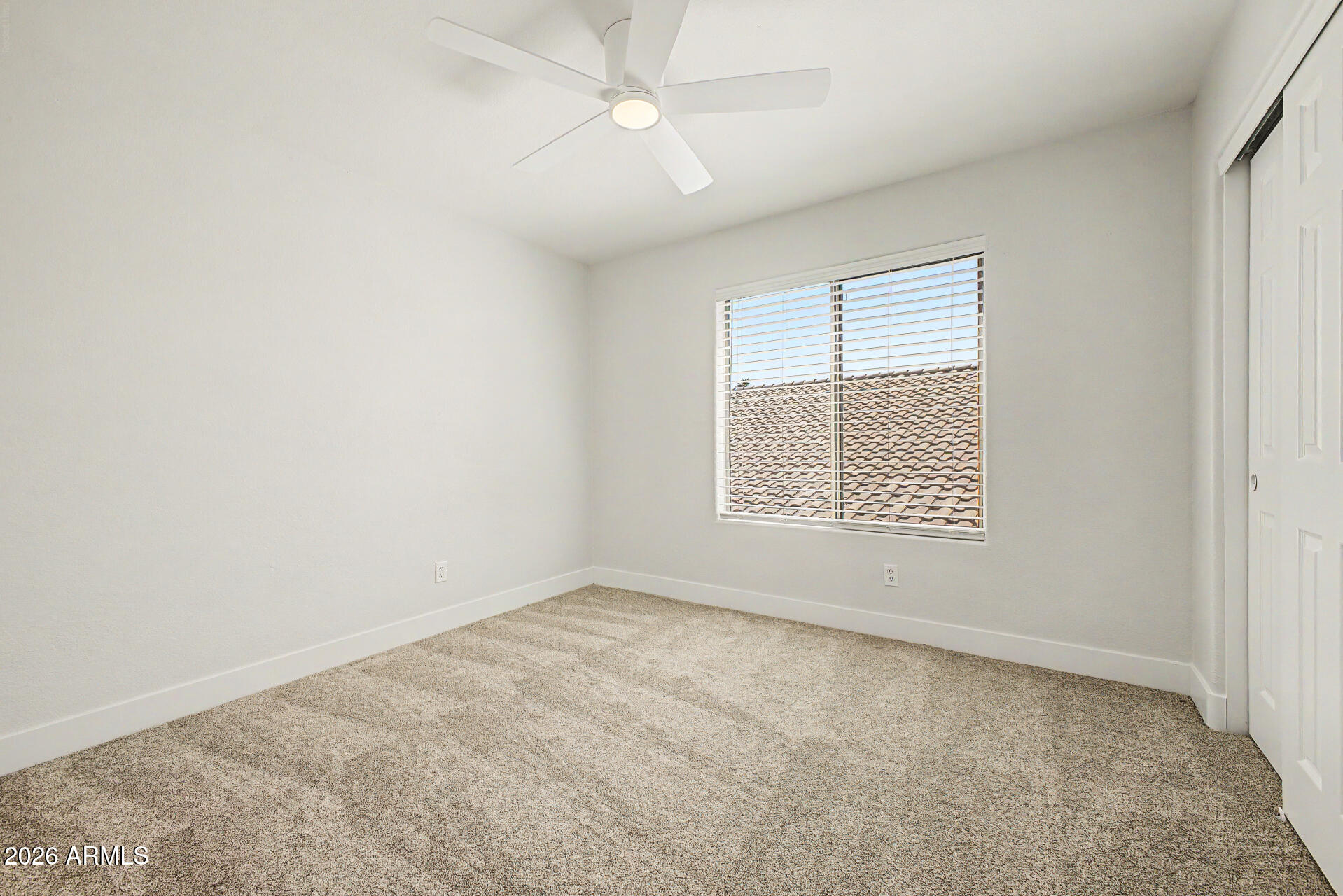 1743 East Redfield Road Gilbert, AZ 85234 - Photo 26 of 30 an empty room with a window