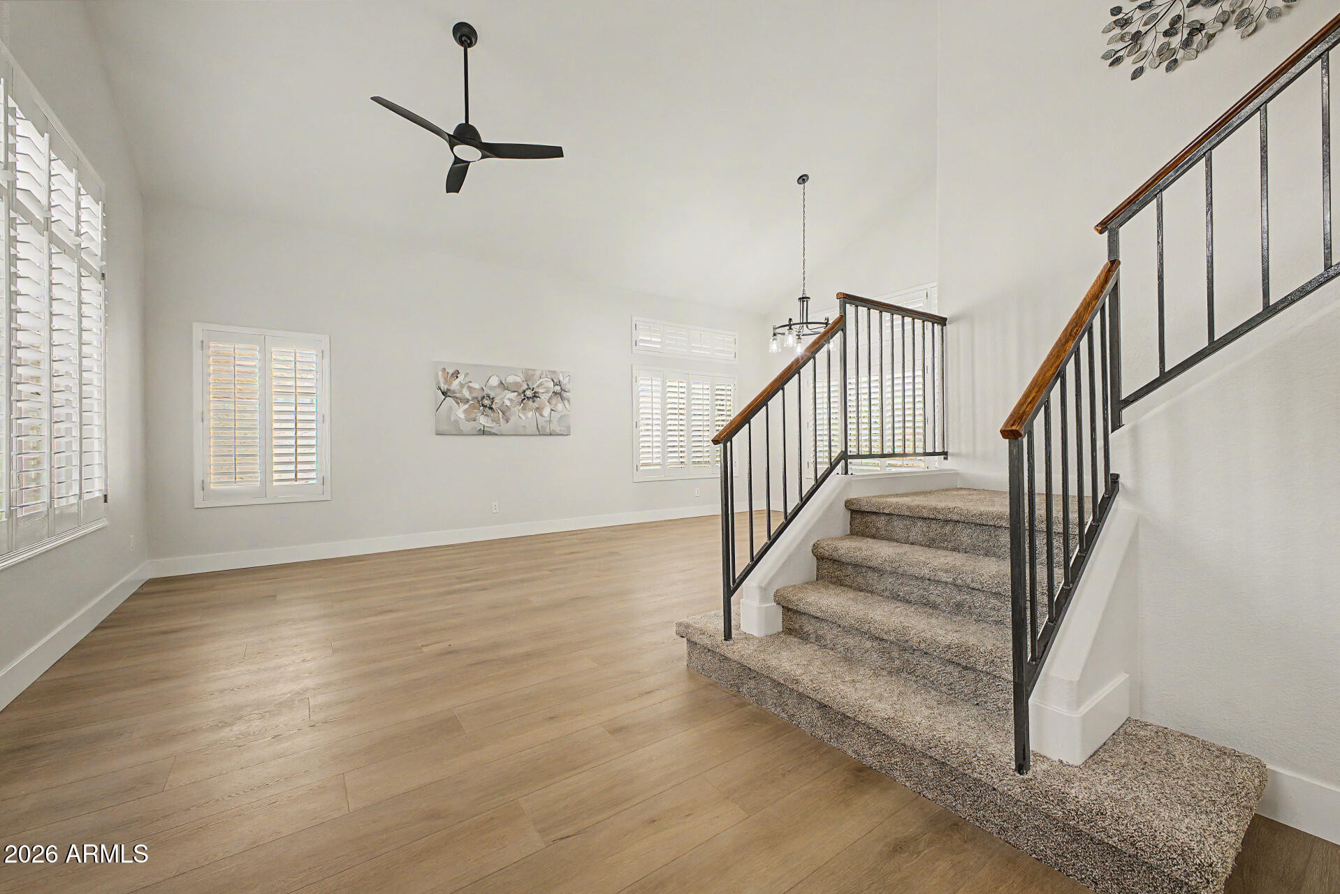 1743 East Redfield Road Gilbert, AZ 85234 - Photo 3 of 30 a view of entryway and hall with wooden floor